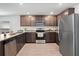 Well-equipped kitchen featuring granite countertops, stainless appliances and ample cabinet space at 1846 N Acadian Dr, Deltona, FL 32725