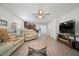 Open living room with wood floors leading into a modern kitchen at 1846 N Acadian Dr, Deltona, FL 32725