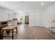 Spacious living area with wood-look flooring and ample natural light from the large window at 1846 N Acadian Dr, Deltona, FL 32725