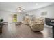 Bright living room featuring wood floors and sliding door to outdoors at 1846 N Acadian Dr, Deltona, FL 32725