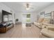 Bright living room with sliding glass doors to the backyard and comfortable seating area at 1846 N Acadian Dr, Deltona, FL 32725