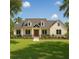 Charming single story home featuring manicured front yard and attractive architectural detail at 1909 S Farm Rd, Deland, FL 32720