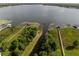 Breathtaking aerial view of a waterfront property with docks and serene lake surroundings at 19232 Park Place Blvd, Eustis, FL 32736