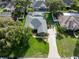 Aerial view of property with enclosed pool and extended driveway for boat parking at 19232 Park Place Blvd, Eustis, FL 32736