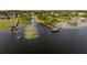 Aerial view of the docks extending into the serene lake, providing access for water activities at 19232 Park Place Blvd, Eustis, FL 32736