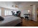 Spacious bedroom with fitness corner, natural light, and laminate floors at 19232 Park Place Blvd, Eustis, FL 32736