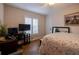 Bedroom with desk, bed, and natural light from the window with privacy shutters at 19232 Park Place Blvd, Eustis, FL 32736