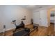 Bedroom with exercise bike, laminate floors, and plenty of closet space at 19232 Park Place Blvd, Eustis, FL 32736