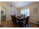 Inviting dining room with wood table set, chandelier lighting, and classic window shutters at 19232 Park Place Blvd, Eustis, FL 32736
