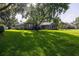 Beautiful lawn view of home with mature tree and meticulously kept lawn at 19232 Park Place Blvd, Eustis, FL 32736