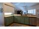 Well-lit kitchen with stainless steel appliances, stylish cabinetry, and granite countertops for modern living at 19232 Park Place Blvd, Eustis, FL 32736