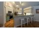Well-lit kitchen features modern appliances and bar seating at 19232 Park Place Blvd, Eustis, FL 32736