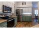 Well-appointed kitchen with stainless steel appliances and a charming color scheme at 19232 Park Place Blvd, Eustis, FL 32736