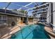 Sparkling pool with screen enclosure, patio and exterior view, perfect for outdoor enjoyment and relaxation at 19232 Park Place Blvd, Eustis, FL 32736