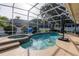 Sparkling pool and spa with screened enclosure and lush landscaping at 19232 Park Place Blvd, Eustis, FL 32736