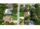 An aerial view of a neighborhood showcasing well-maintained lawns and mature trees offering privacy at 204 Rio Pinar Dr, Ormond Beach, FL 32174