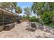Open backyard featuring a large stone patio area and screened lanai, perfect for outdoor living at 204 Rio Pinar Dr, Ormond Beach, FL 32174