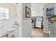 Half bath and laundry room with modern appliances and updated fixtures at 204 Rio Pinar Dr, Ormond Beach, FL 32174