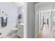 Hallway view of the bathroom with tiled floors, walk-in shower, and vanity at 204 Rio Pinar Dr, Ormond Beach, FL 32174