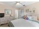Relaxing bedroom features a comfortable bed, dresser, window, and ceiling fan at 204 Rio Pinar Dr, Ormond Beach, FL 32174