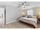 Comfortable bedroom with a ceiling fan and bright natural light coming from the window at 204 Rio Pinar Dr, Ormond Beach, FL 32174