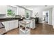 Bright kitchen features white cabinetry, granite countertops, stainless steel appliances, and an island at 204 Rio Pinar Dr, Ormond Beach, FL 32174