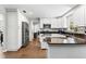 Updated kitchen featuring white cabinetry, stainless steel appliances, and stone countertops at 204 Rio Pinar Dr, Ormond Beach, FL 32174