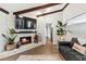 Comfortable living room with brick fireplace and view into the kitchen at 204 Rio Pinar Dr, Ormond Beach, FL 32174