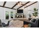 Inviting living room with exposed wood beams and a cozy brick fireplace at 204 Rio Pinar Dr, Ormond Beach, FL 32174