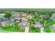 Neighborhood view showcasing a home with a manicured lawn, and mature trees at 2263 Catbriar Way, Oviedo, FL 32765