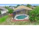 Aerial view of screened in pool and outdoor space, surrounded by trees at 2263 Catbriar Way, Oviedo, FL 32765