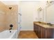 Bathroom features double sinks, framed mirrors, and a tiled shower with tub at 2263 Catbriar Way, Oviedo, FL 32765
