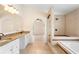 This bathroom showcases a granite countertop, dual sinks, and a tiled walk-in shower at 2263 Catbriar Way, Oviedo, FL 32765