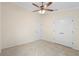 This bedroom features neutral carpet, white trim, and a ceiling fan at 2263 Catbriar Way, Oviedo, FL 32765