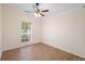 A bedroom featuring wood floors, neutral walls, and bright natural light at 2263 Catbriar Way, Oviedo, FL 32765