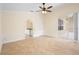 Bright bedroom with tile floors, ceiling fan, and sliding doors to the outdoor patio at 2263 Catbriar Way, Oviedo, FL 32765