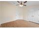 Bedroom featuring wood floors, a ceiling fan and closet at 2263 Catbriar Way, Oviedo, FL 32765