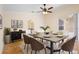 Elegant dining room with a modern table, stylish chairs, and access to the outdoor patio at 2263 Catbriar Way, Oviedo, FL 32765