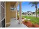 Charming home exterior with well-manicured lawn and inviting front porch with decorative columns at 2263 Catbriar Way, Oviedo, FL 32765