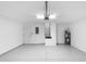 View of the spacious, clean garage featuring a water heater and door to the house at 2263 Catbriar Way, Oviedo, FL 32765