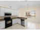 Well-lit kitchen featuring granite countertops, white cabinets, and stainless steel appliances at 2263 Catbriar Way, Oviedo, FL 32765