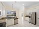 Bright kitchen featuring granite countertops, stainless steel appliances, and a view of the pool at 2263 Catbriar Way, Oviedo, FL 32765