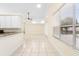 Bright, open living room with tile flooring, fan, and sliding glass doors leading to the outside at 2263 Catbriar Way, Oviedo, FL 32765