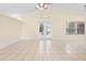 Expansive living room with vaulted ceilings, tile floors, and access to the pool area at 2263 Catbriar Way, Oviedo, FL 32765