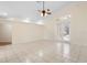 Bright living room showcasing tile flooring and access to outdoor space through glass doors at 2263 Catbriar Way, Oviedo, FL 32765