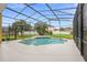Screened pool area with stylish pool, beautiful landscaping and an attractive deck space at 2263 Catbriar Way, Oviedo, FL 32765