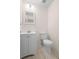 A half bathroom featuring tile floors, a mirror, toilet, and a vanity at 2263 Catbriar Way, Oviedo, FL 32765