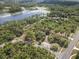 Aerial view showcasing lake and road access, offering picturesque views and convenience for those seeking a serene environment at 2620 Doyle Rd, Deltona, FL 32738