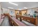 Well lit auditorium featuring wooden pews, a stage, and dual exit doors at 2620 Doyle Rd, Deltona, FL 32738