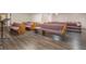 Spacious auditorium with multiple rows of wooden pews on wood floors at 2620 Doyle Rd, Deltona, FL 32738